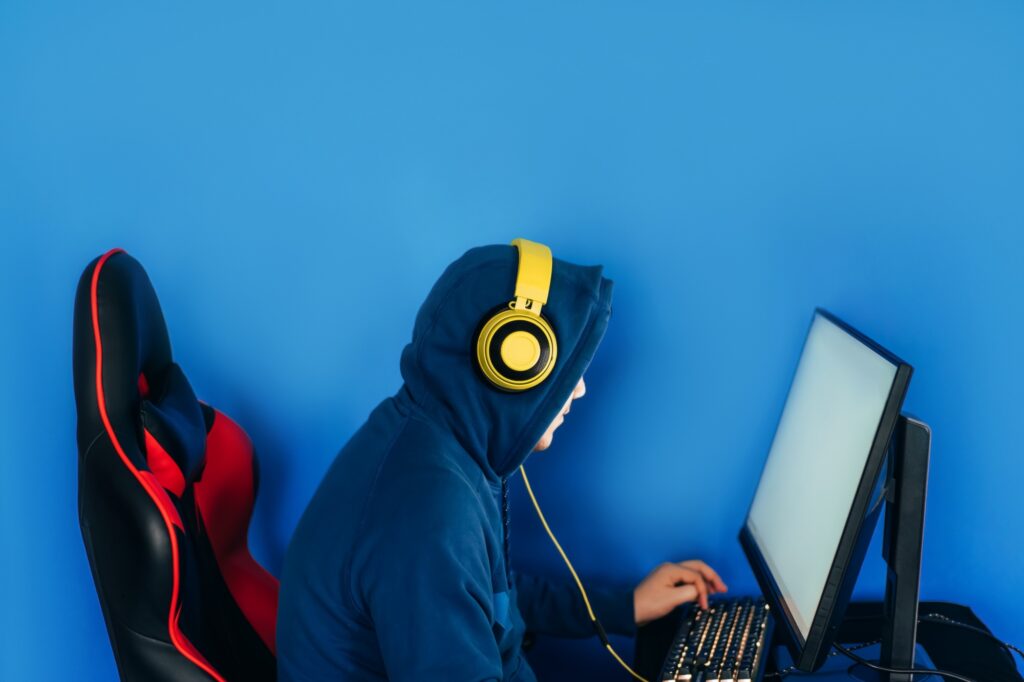 The gamer sits on a gaming chair